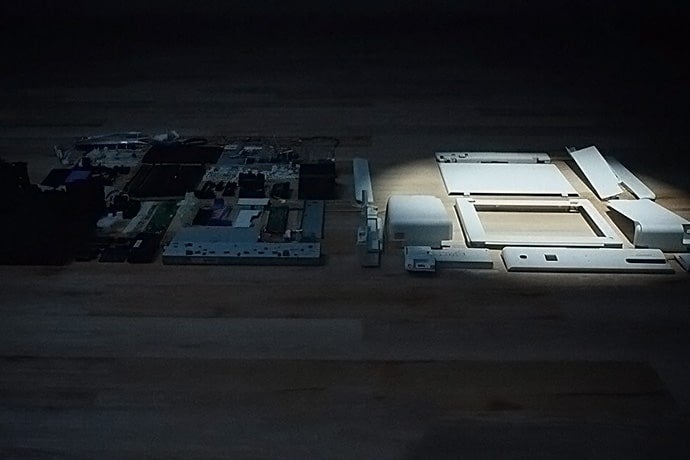 Disassembled EP-M553T (the right part: parts made of recycled plastic)